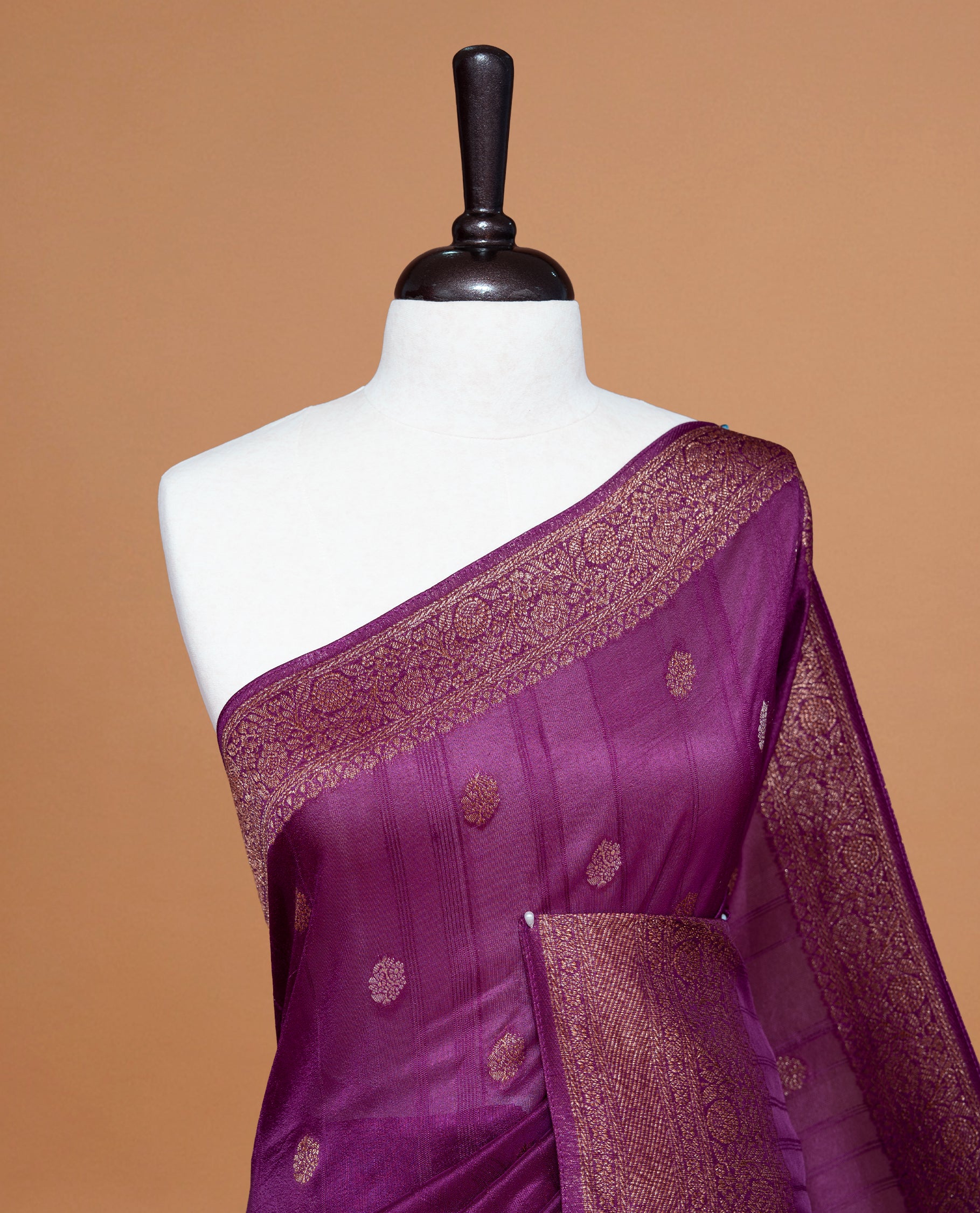 Deep Purple colour Semi banaras tussar georgette Saree featuring Antique zari motifs on body, enhanced with antique zari border, paired with a matching blouse piece.