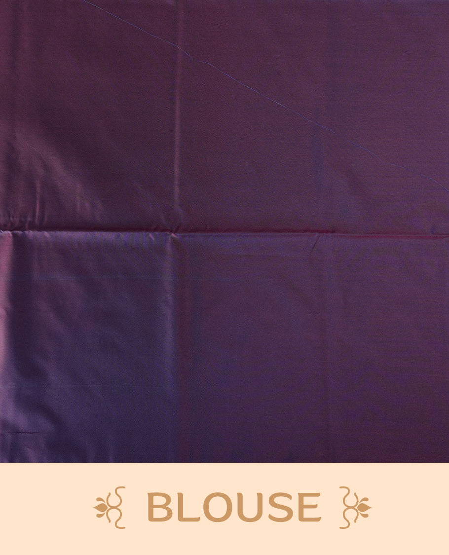 Dual tone blue green semi soft silk saree adorned with woven circular motifs on the body, complemented by a rich contrast plum colour woven pallu with tassel detailing & Comes with a matching blouse piece.