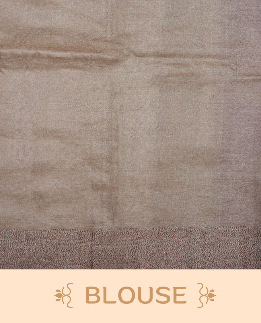 Light brown colour pure banaras tusser silk saree highlighting antique zari pattern across body, with contrast cream colour with zari border and paired with matching blouse