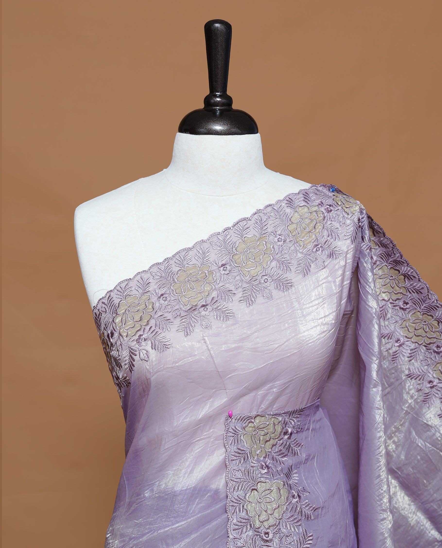 Pastel purple colour Crush Organza Featuring Plain body, Enrich with Floral thread pattern & scalp border, paired with matching blouse piece.