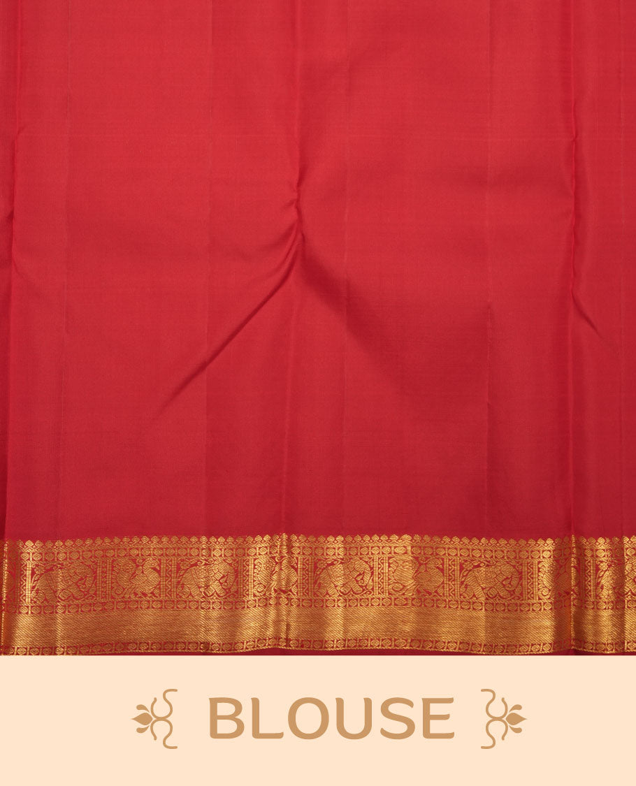 Red colour pure traditional Kancheepuram silk saree adorned with an elegant zari motif on the body