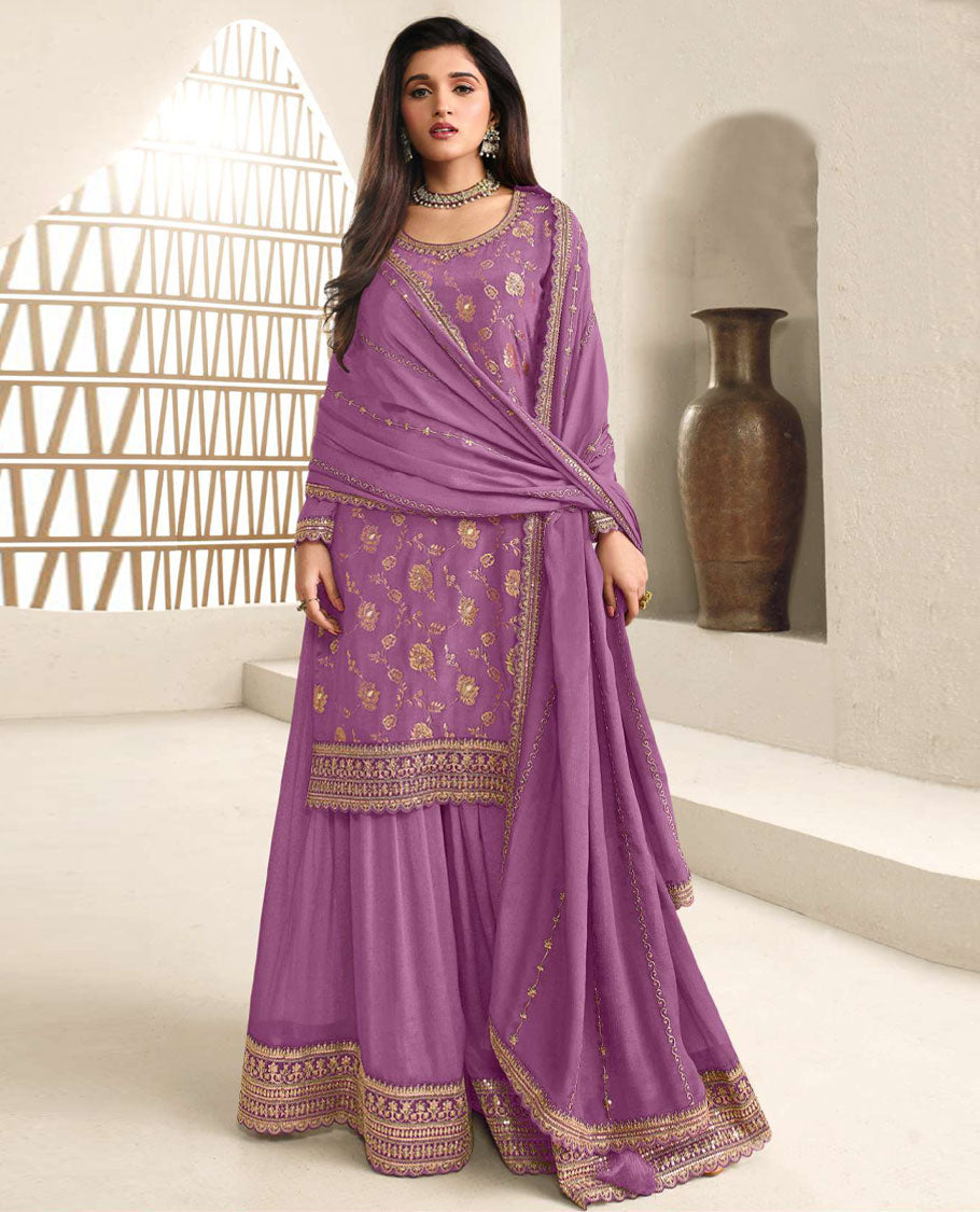Lavender colour semi stitched salwar suit featuring an embroidered chinon top material paired with a matching sharara bottom, and dupatta.