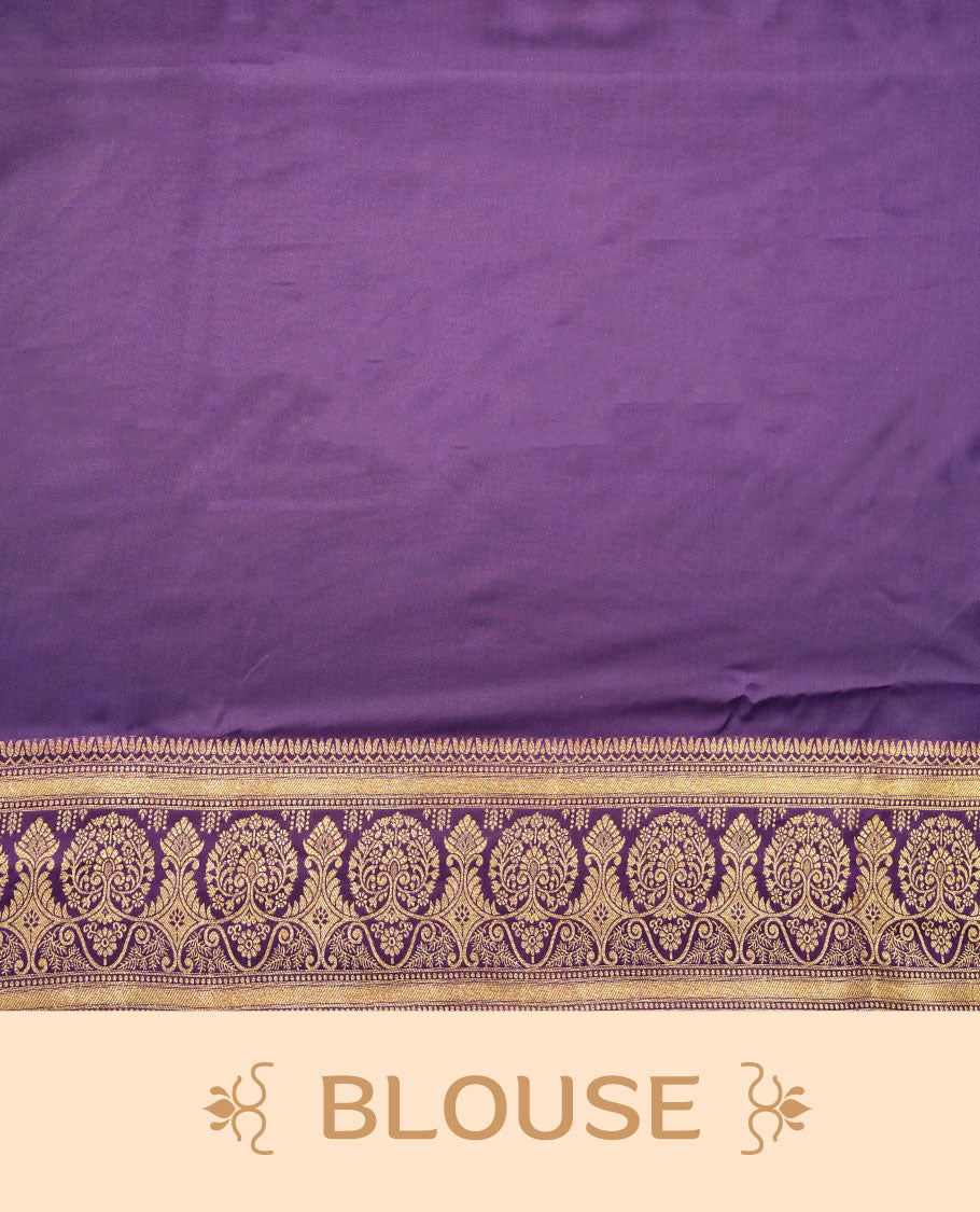 Indigo colour Banaras Satin Crepe saree featuring gold zari floral motifs on the body, a richly woven traditional border with intricate gold zari detailing, and paired with a matching blouse.