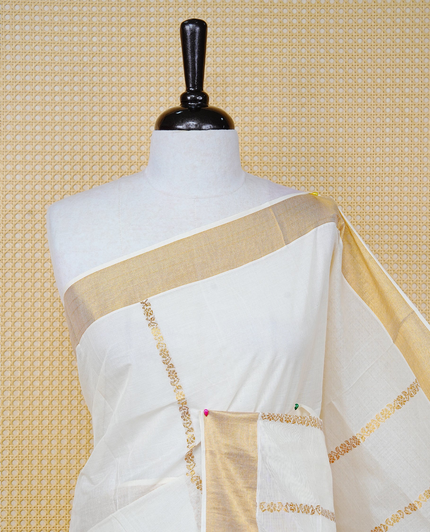 Cream Colour Cotton Kerala Saree Featuring an Elegant Plain Body, a Classy Gold Zari Border, and a Traditional Gold Zari Pallu with Maroon Accents, Paired with a Matching Blouse Piece.