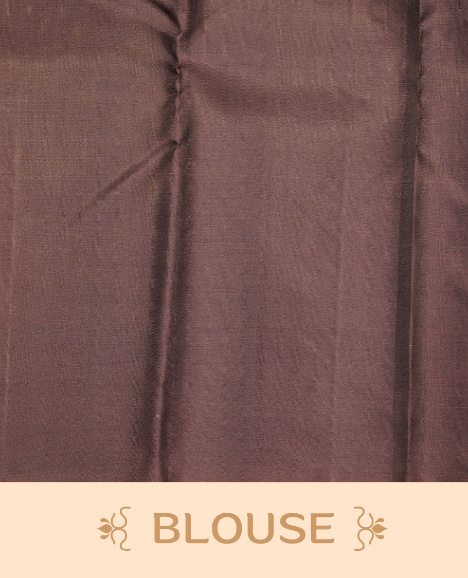Grey colour soft silk saree featuring vertical lines on body, complemented by contrast burgundy brown with peacock buttas border.