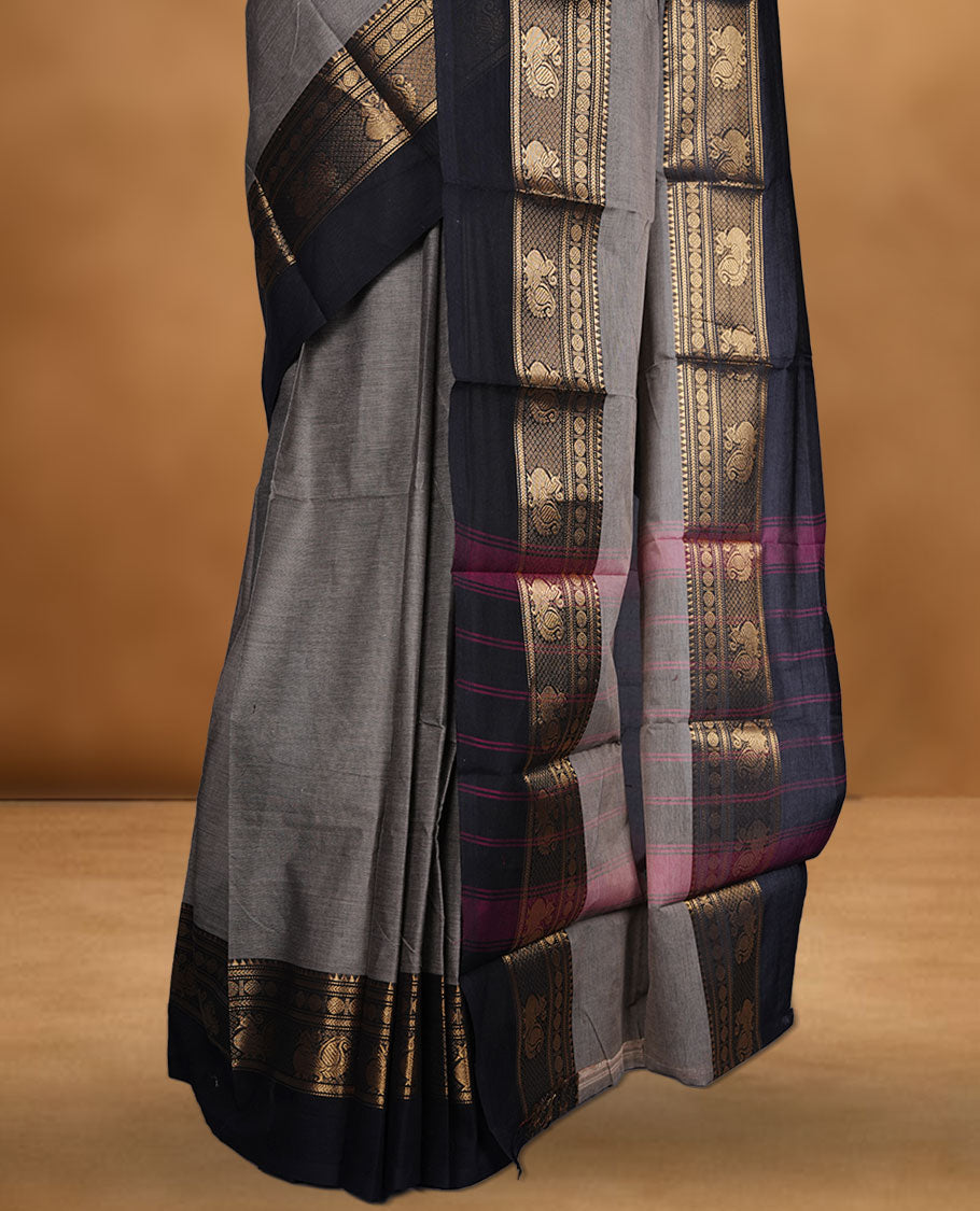 Beige grey colour chettinad cotton saree featuring plain body, contrast black colour with traditional gold zari border without blouse.