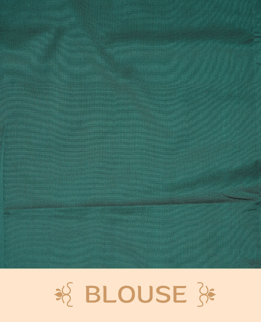 Teal green soft silk saree features a sleek borderless design with intricate antique zari motifs, flowing into a seamless self colored pallu and a matching blouse piece.