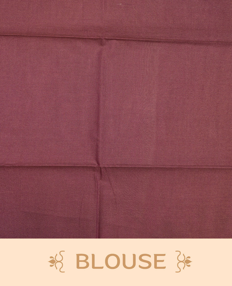 Burgundy colour semi jute saree highlighting gold zari stripped body with white motifs, without border and paired with matching blouse.
