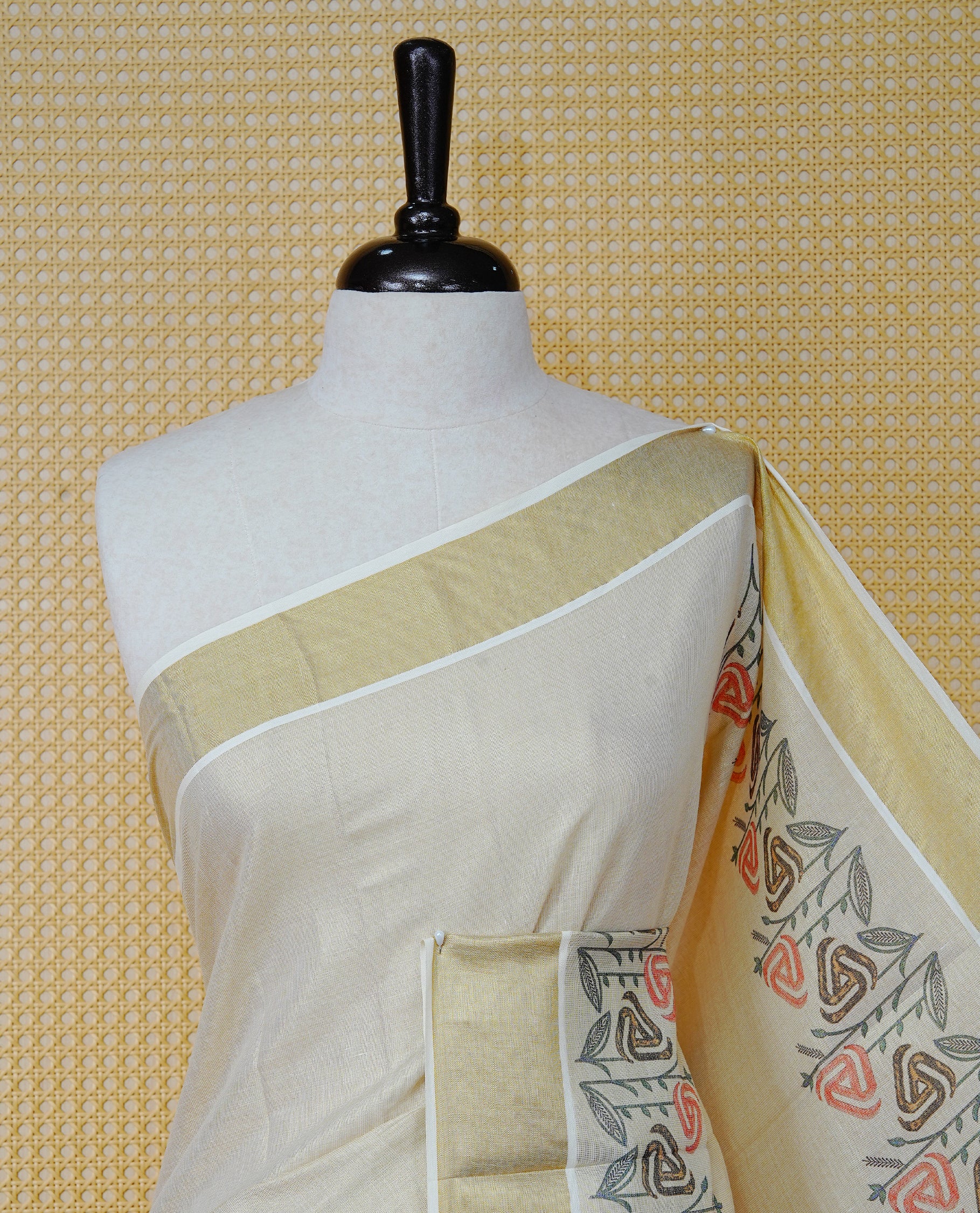 Cream Colour Tissue Kerala Saree Featuring A Digital Floral Printed Body, Highlighted With Classy Gold Zari Border Black & Yellow Tassel At Pallu, Paired With A Matching Blouse Piece.