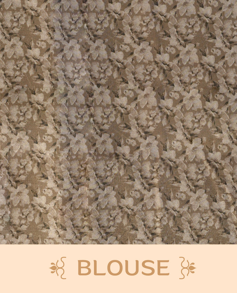 Pastel brown colour saree adorned with elegant floral prints on the body, enhanced with a subtle matching border, complemented by a beautifully printed pallu featuring blooming flowers, and paired with a matching blouse.
