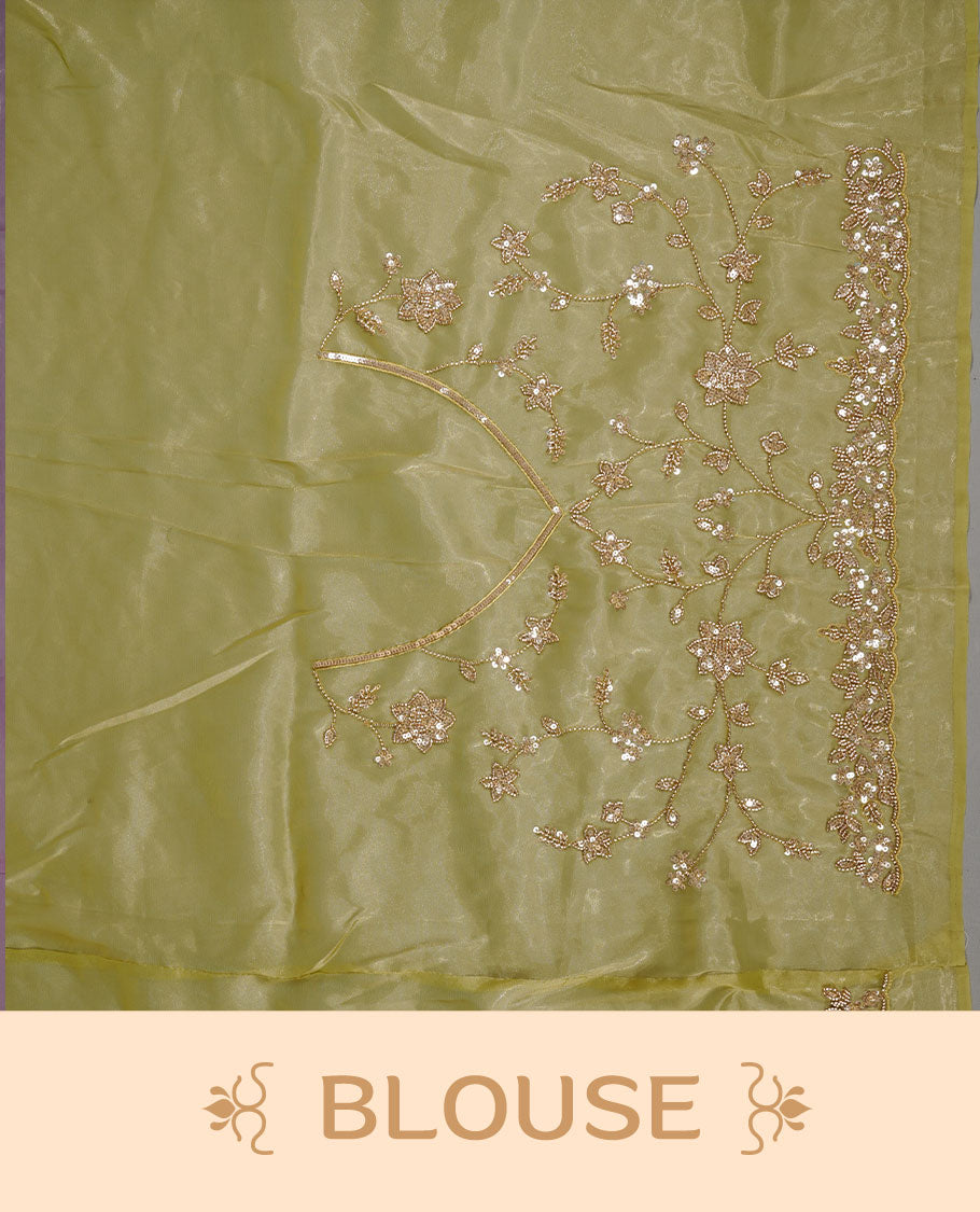 Olive colour net organza saree featuring cut beats and sequins floral kodi pattern on body, enhanced with worked border and cut beats work on blouse piece.