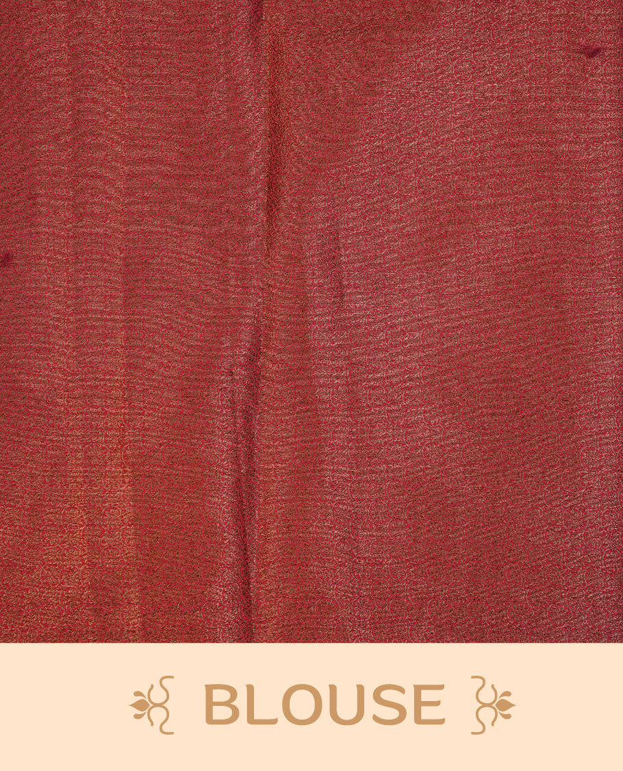Pinkish red colour semi banaras tussar silk saree highlighting gold zari bird motifs on body, complemented by self colour with antique zari border, paired with matching blouse piece.