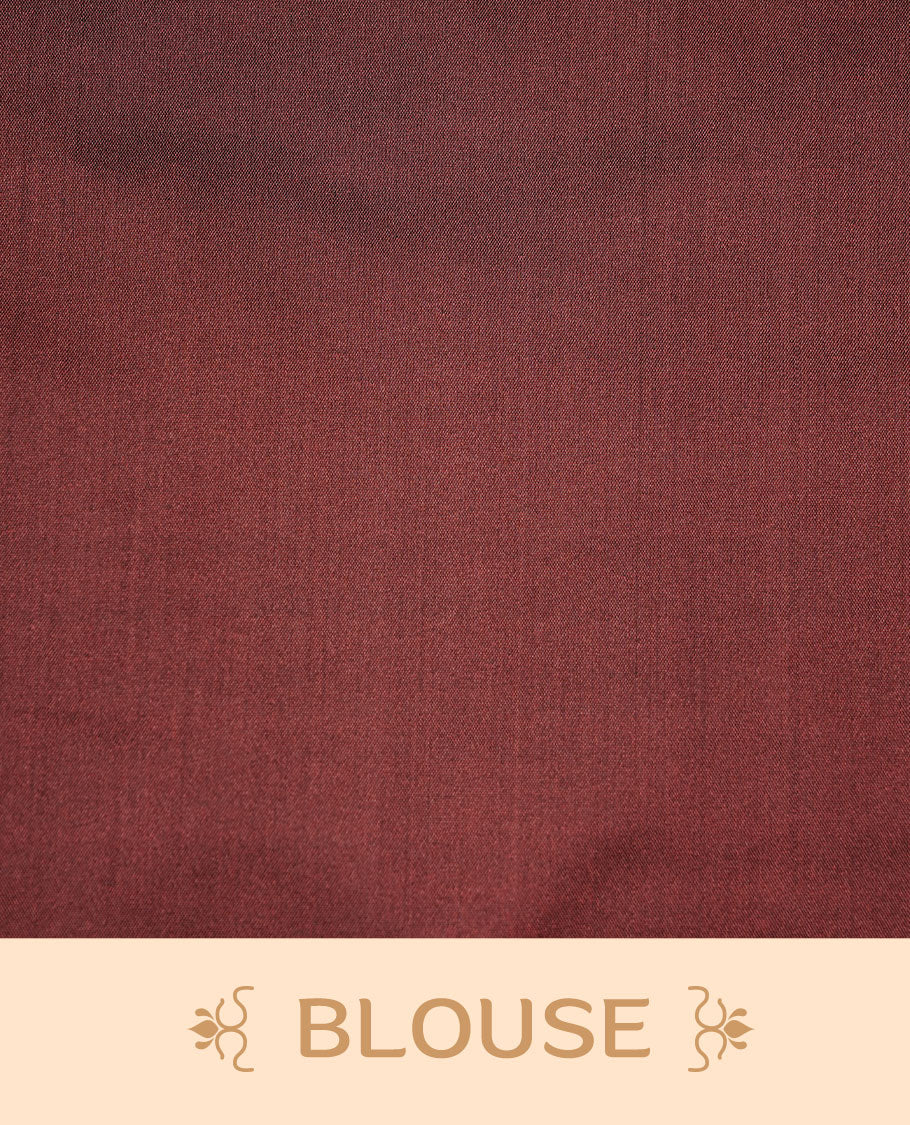Lavender colour soft silk saree features a sleek borderless design with intricate antique zari motifs, flowing into a striking contrast maroon pallu and a matching blouse piece.