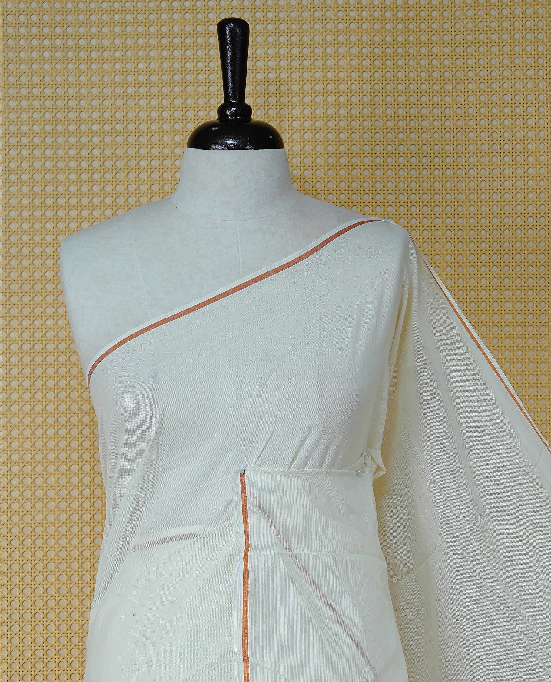 Cream Colour Cotton Kerala Saree Featuring A Classy Plain Body For Effortless Elegance, Enhanced By A Minimalist Orange Border, Paired With A Matching Blouse Piece.
