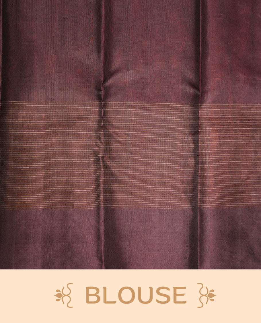Brick red colour soft silk saree featuring zari check on body, complemented by contrast burgundy colour with peacock buttas border, paired with matching.