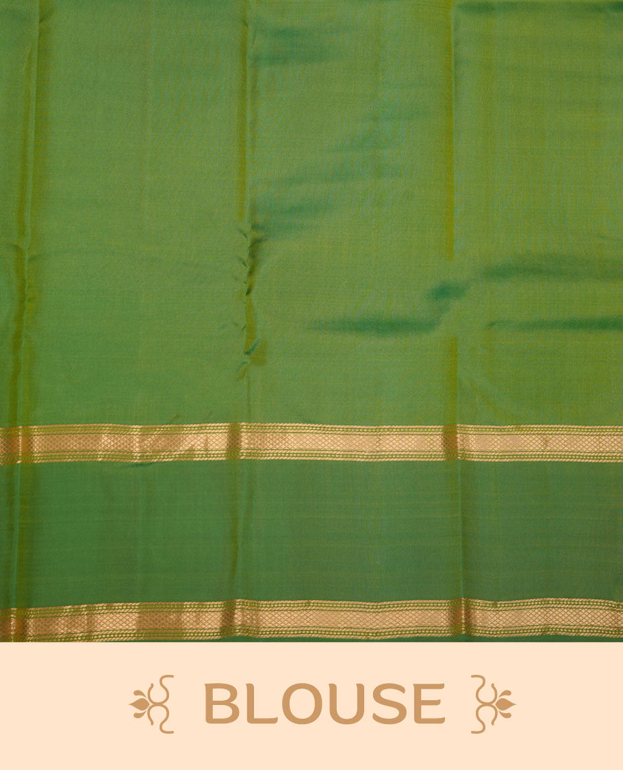 Fluorescent green colour Vasundhara silk saree featuring elegant gold zari buttas across the body, complemented by a contrast leaf green zari border, and paired with a matching blouse piece.