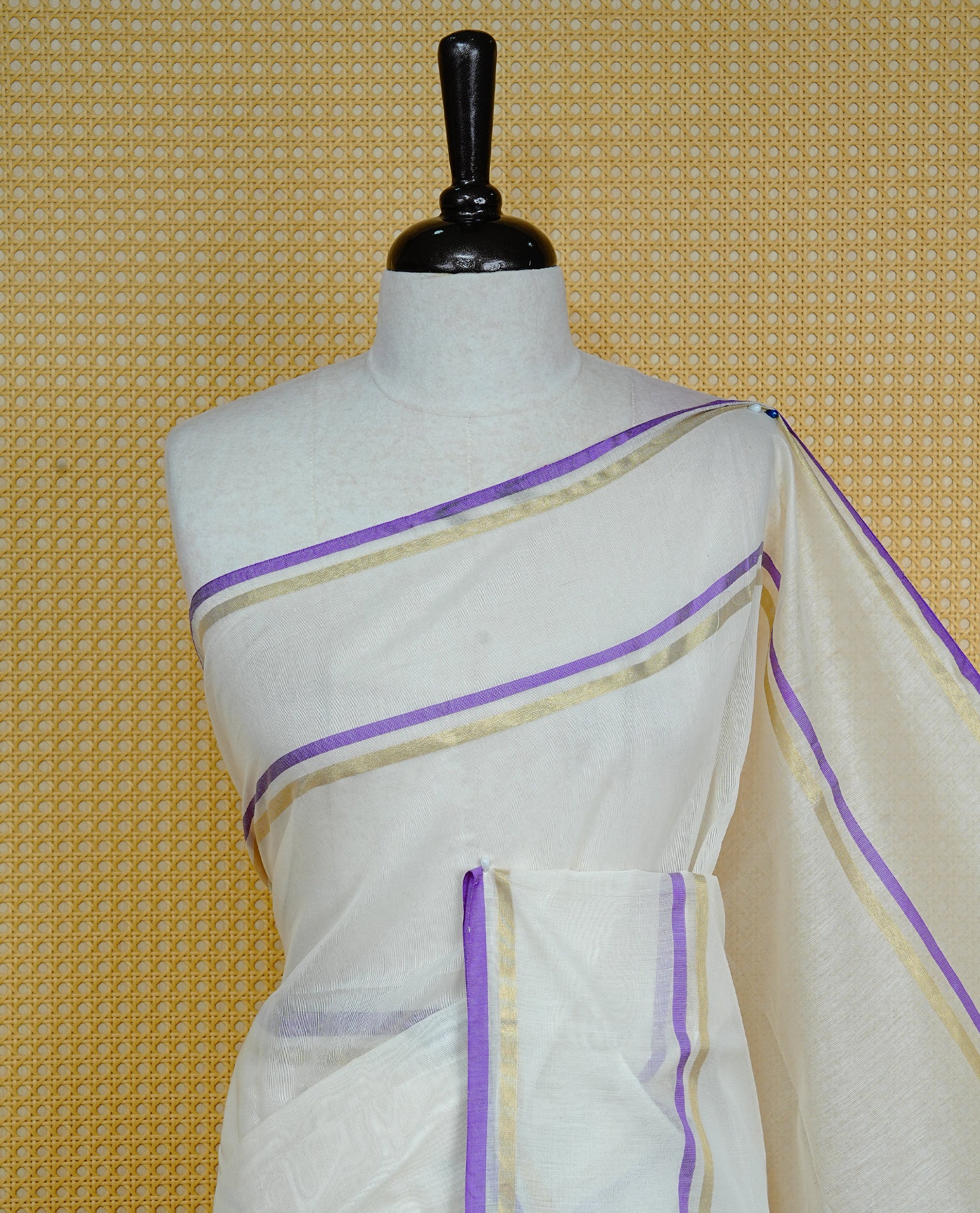 Off white colour semi linen saree featuring Elegant Plain body, complemented by contrast Purple colour with gold zari Simple border, comes with matching blouse piece.