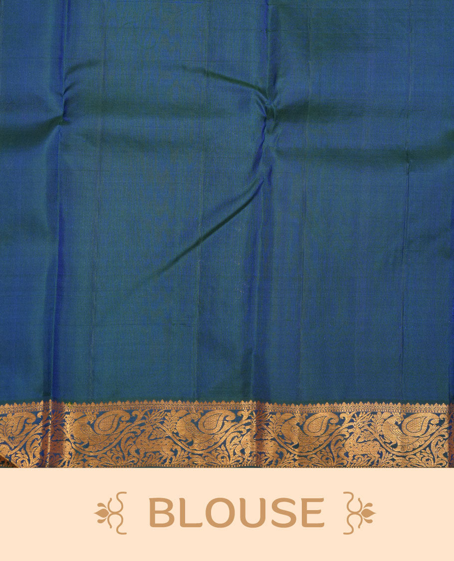 Peacock blue pure traditional Kancheepuram silk saree adorned with gold zari peacock motifs across the body, featuring elegant traditional borders with animal motifs, beautifully paired with a matching blouse piece.