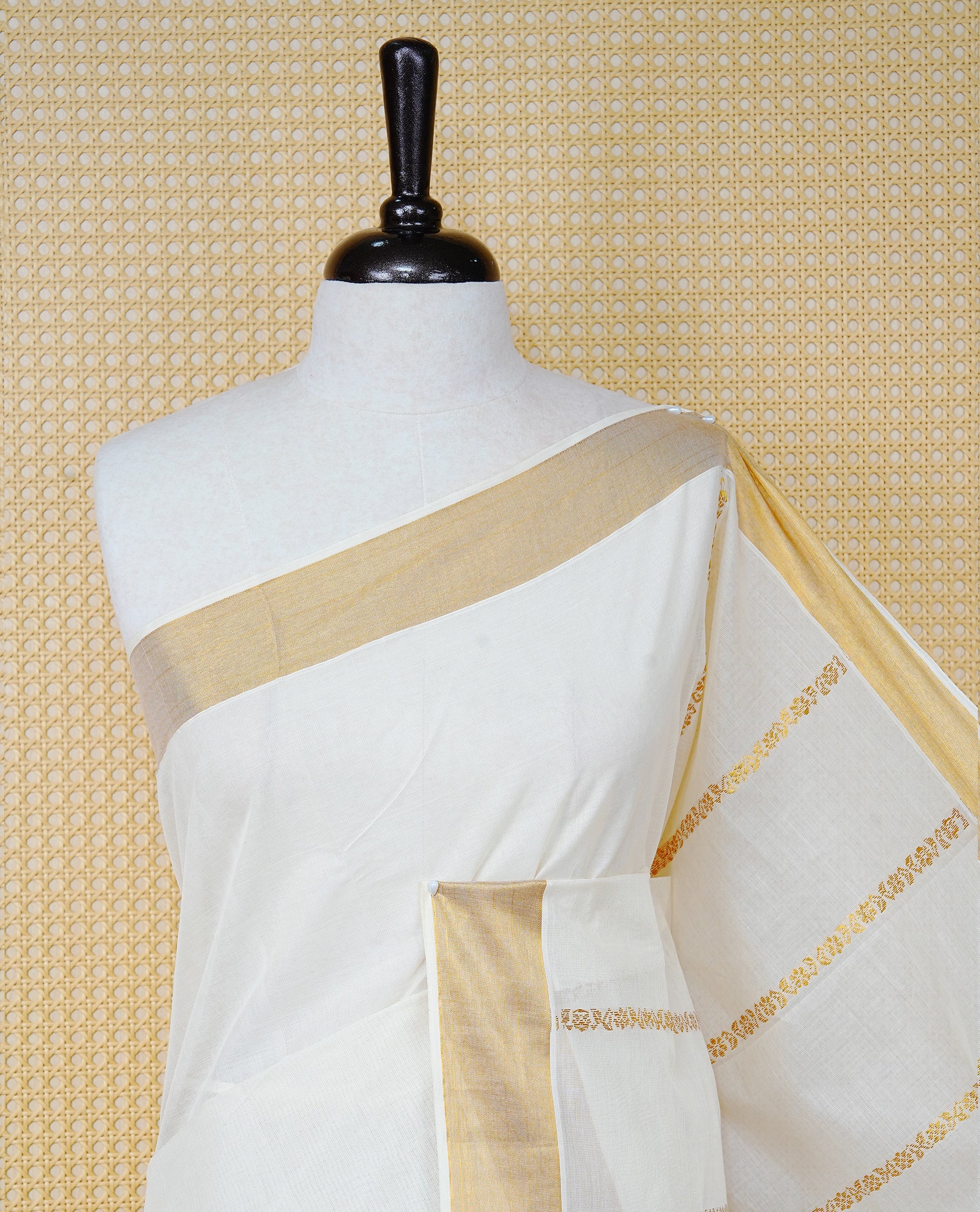 Cream Colour Cotton Kerala Saree Featuring an Elegant Plain Body, a Classy Gold Zari Border, and a Traditional Gold Zari Pallu with Brown Accents, Paired with a Matching Blouse Piece.
