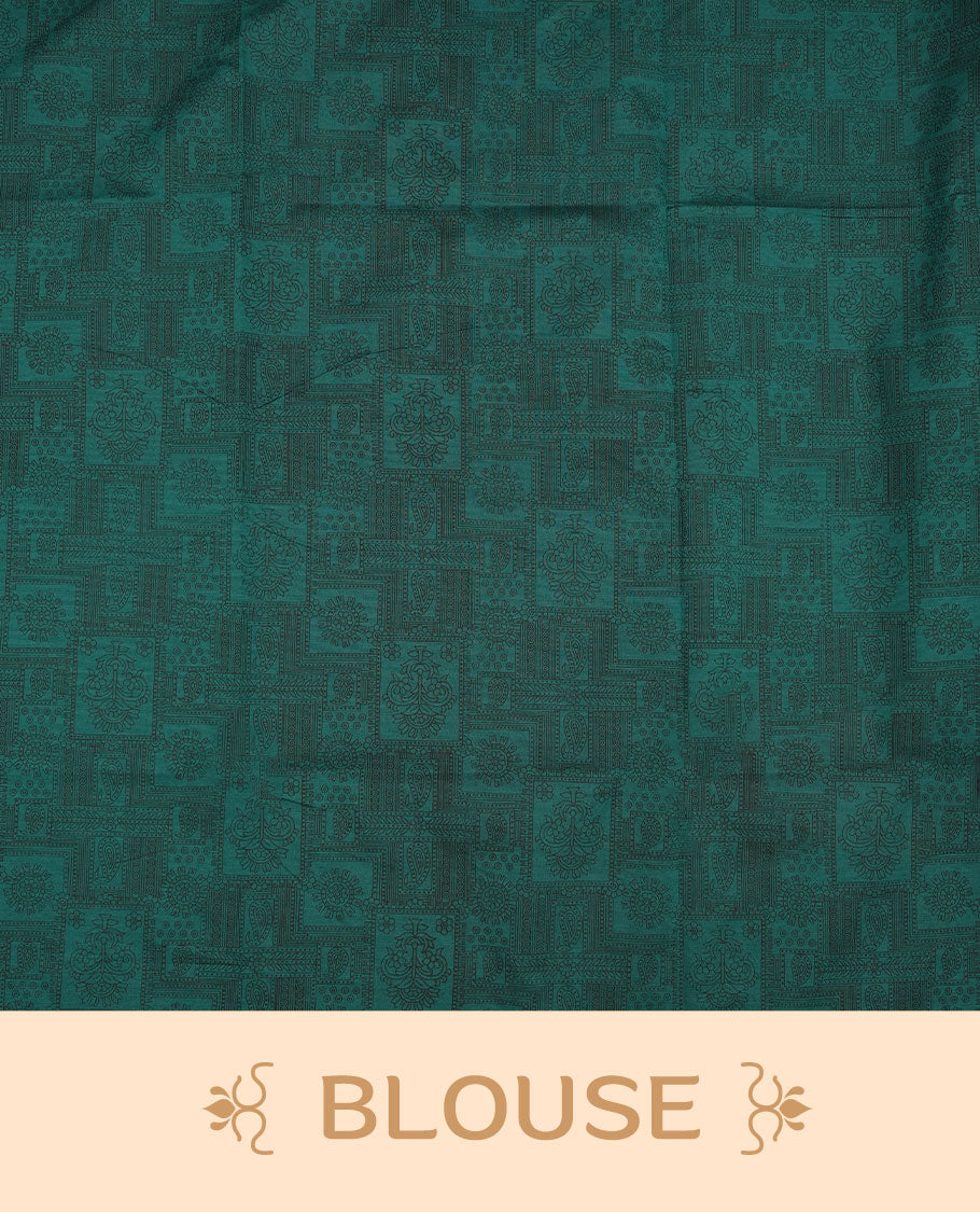 Dark Teal Green colour poly cotton saree with black zigzag line pattern on the body, paired with a matching pallu featuring black chevron lines and panelled floral‑paisley design, and a coordinated all‑over floral paisley patch‑style printed blouse piece.
