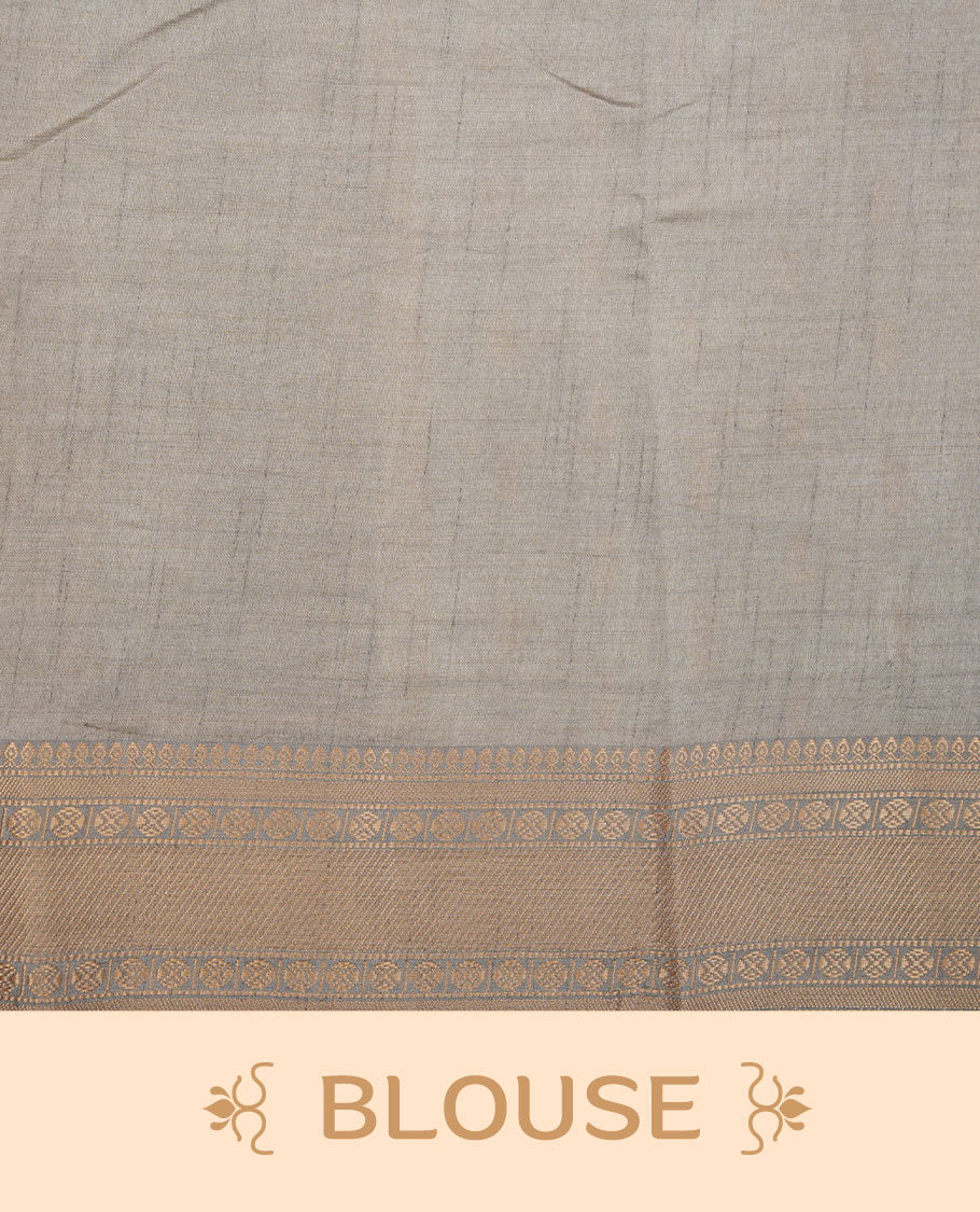 Cream colour tussar saree featuring litte gold zari motifs on body, contrast grey colour border and pallu with zari woven design, comes with matching blouse piece.