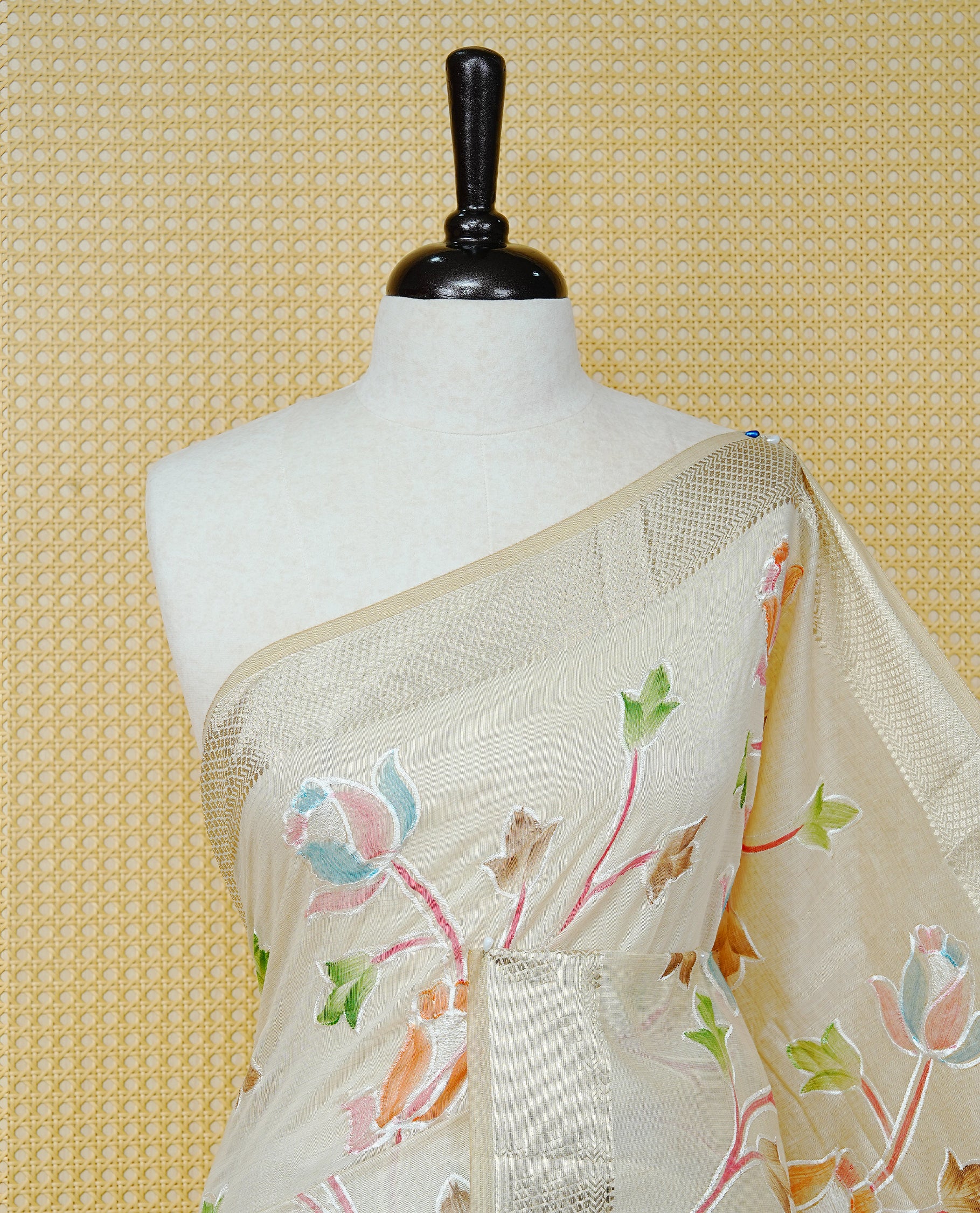 Cream Colour Tissue Kerala Saree Featuring Floral Kodi Threadwork Across The Body, Enhanced With A Light Gold Zari Border And A Peach Floral Pallu, Finished With Gold Tassels And A Matching Blouse Piece