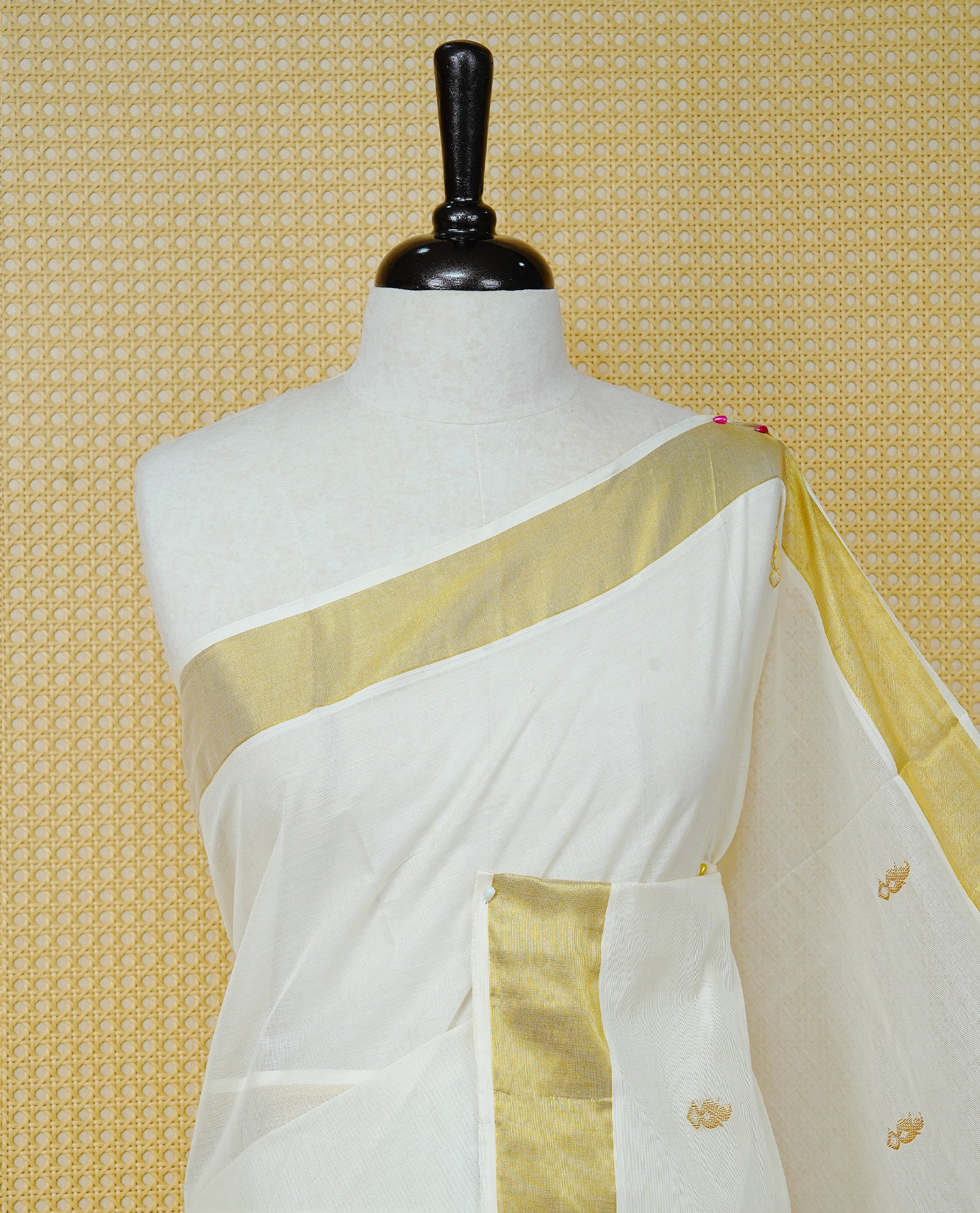 Cream Colour Cotton Kerala Saree Featuring Delicate Gold Mango Motifs Across The Body, Enhanced With A Traditional Gold Zari Border, A Gold Mango & Striped Gold Zari Pallu, Finished With A Matching Blouse Piece