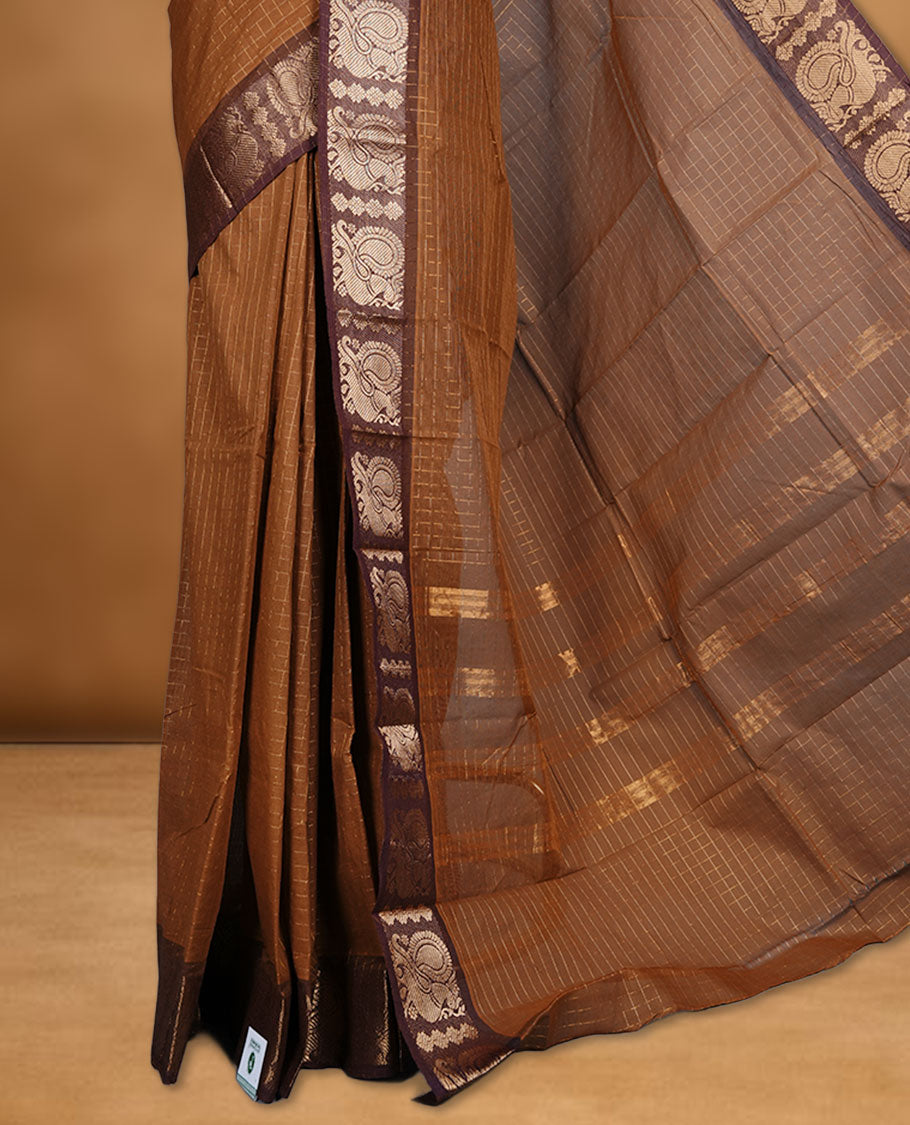 Goldenrod colour sungudi cotton saree featuring gold zari check pattern across body, contrast Brown colour with gold zari peacock pattern on border, without blouse piece.