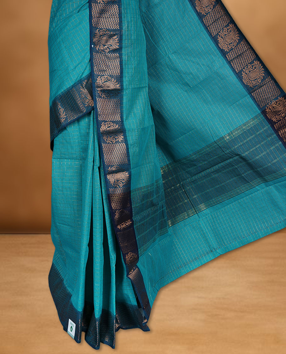 Aqua colour sungudi cotton saree featuring gold zari check pattern across body, contrast Teal colour with gold zari pattern on border, without blouse piece.
