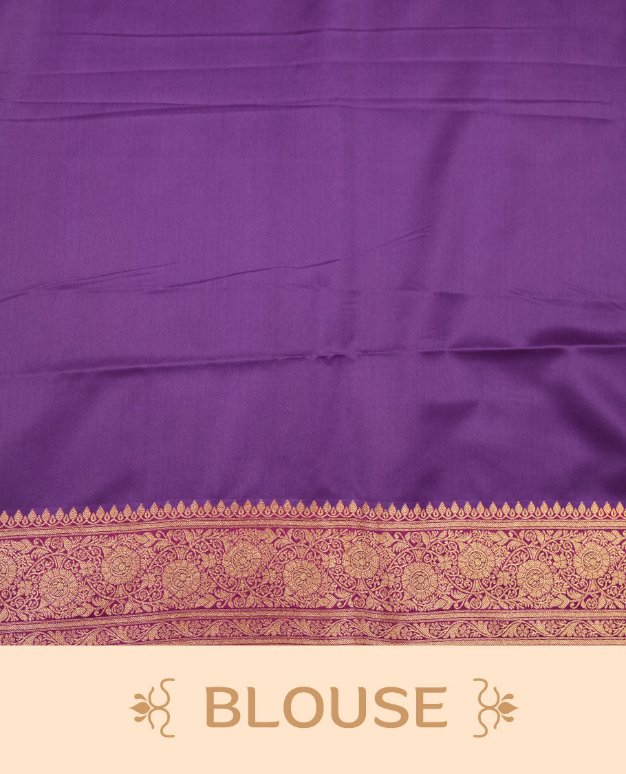Purple colour Banaras Satin Crepe saree featuring gold zari buttas on the body, a richly woven traditional border with gold zari detailing, and paired with a matching blouse.