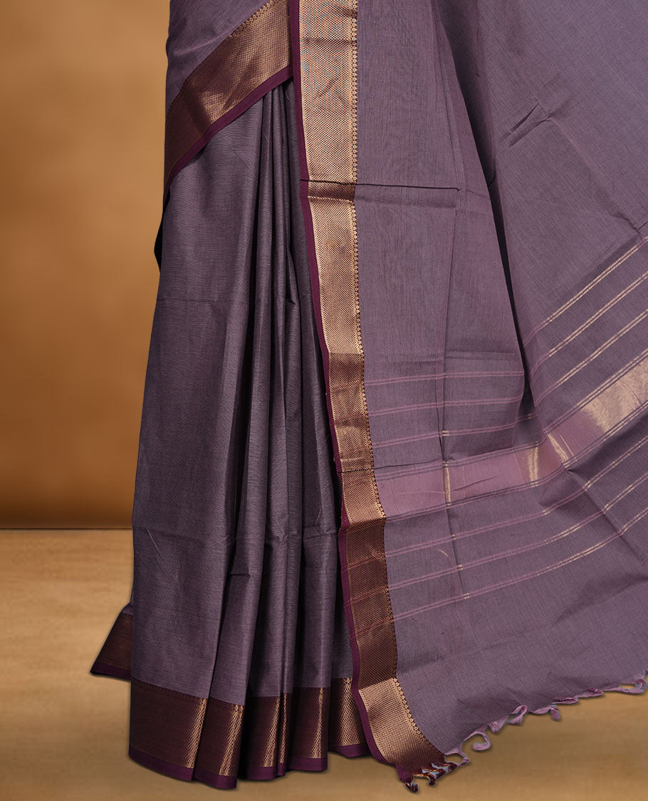 Lilac colour chettinad cotton saree featuring Elegant plain body highlighting contrast Maroon colour with gold zari traditional border, pallu and paired with matching blouse piece.