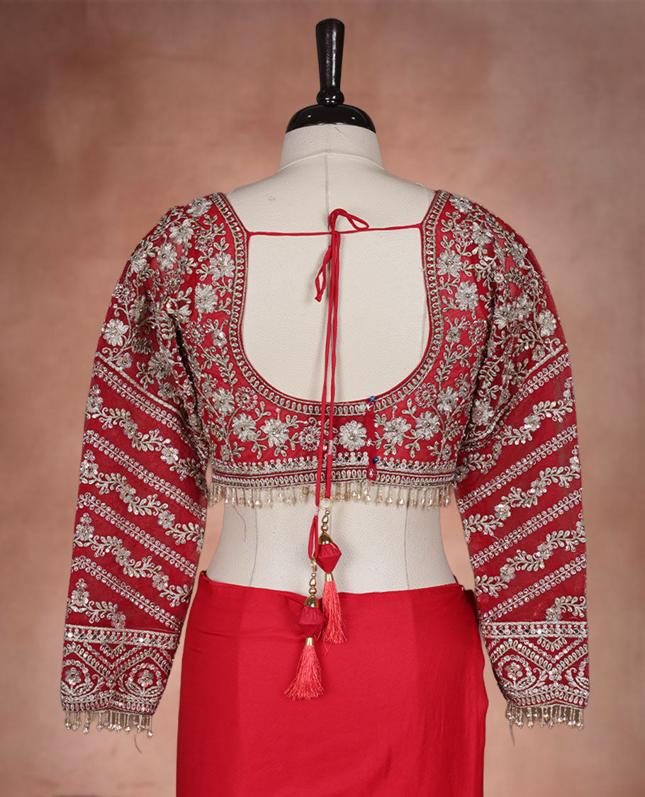 Red Colour net designer Wedding saree featuring all over floral embroidery with sequin detailing and an ornate scalloped border, finished with a matching embellished blouse.
