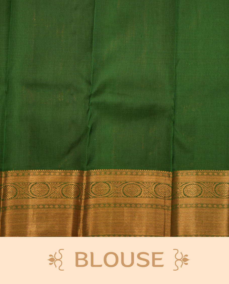 Rani pink colour pure traditional Kancheepuram silk saree adorned with gold zari peacock & chakra motifs across the body, featuring elegant traditional borders, beautifully paired with a matching blouse piece.