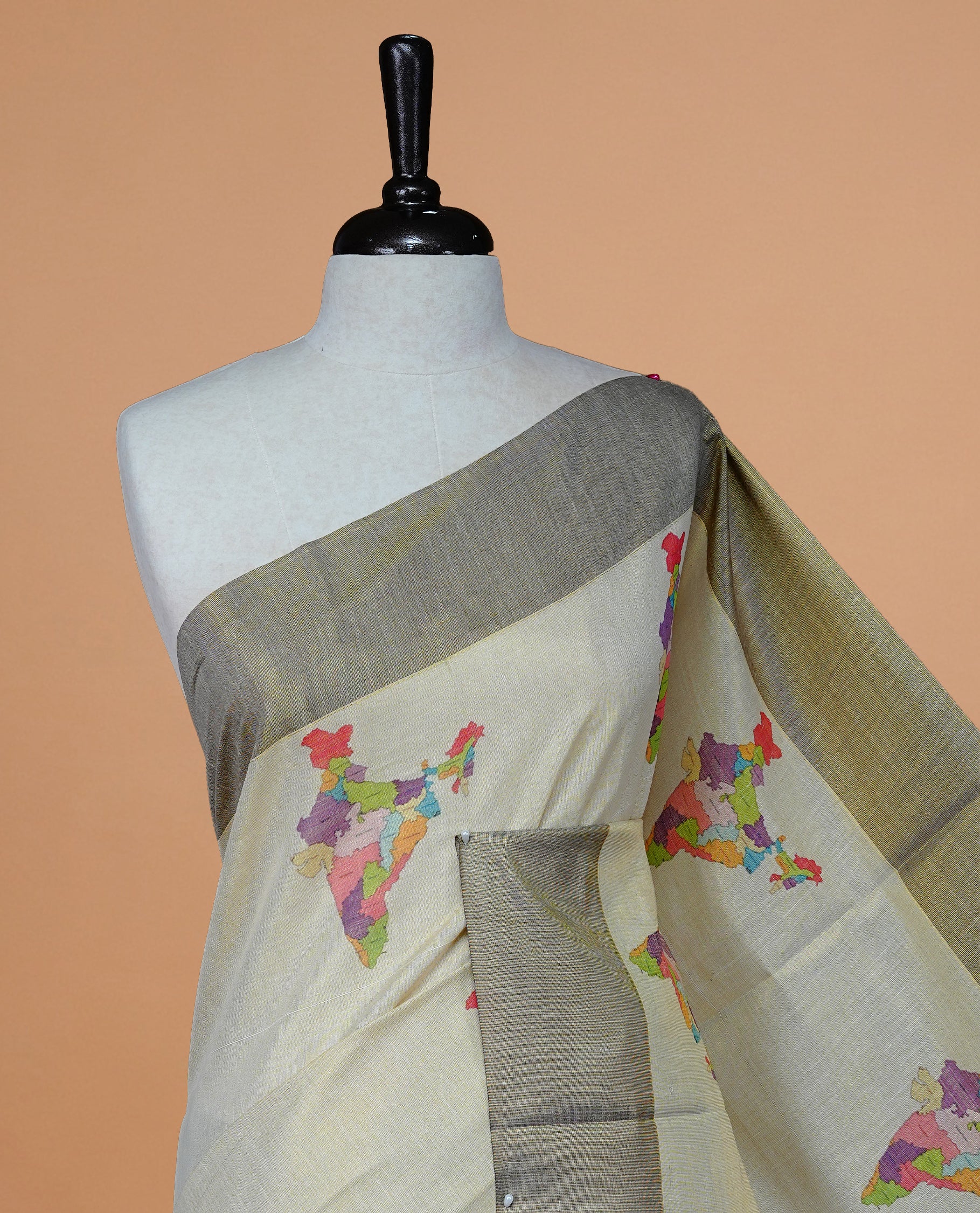 Cream Colour Kerala Saree Featuring Plain Body ,Complemented By A Burgundy Zari With Indian Map Border ,Enhance By A Gold Zari & Burgundy Pallu ,Paired With A Matching Blouse Piece.