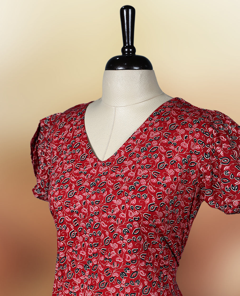 Red colour printed nightwear with floral patterns, V neckline, and short puff sleeves, Tailored for a flattering fit with a flared hem & perfect for casual outings or daily ethnic wear with comfort.