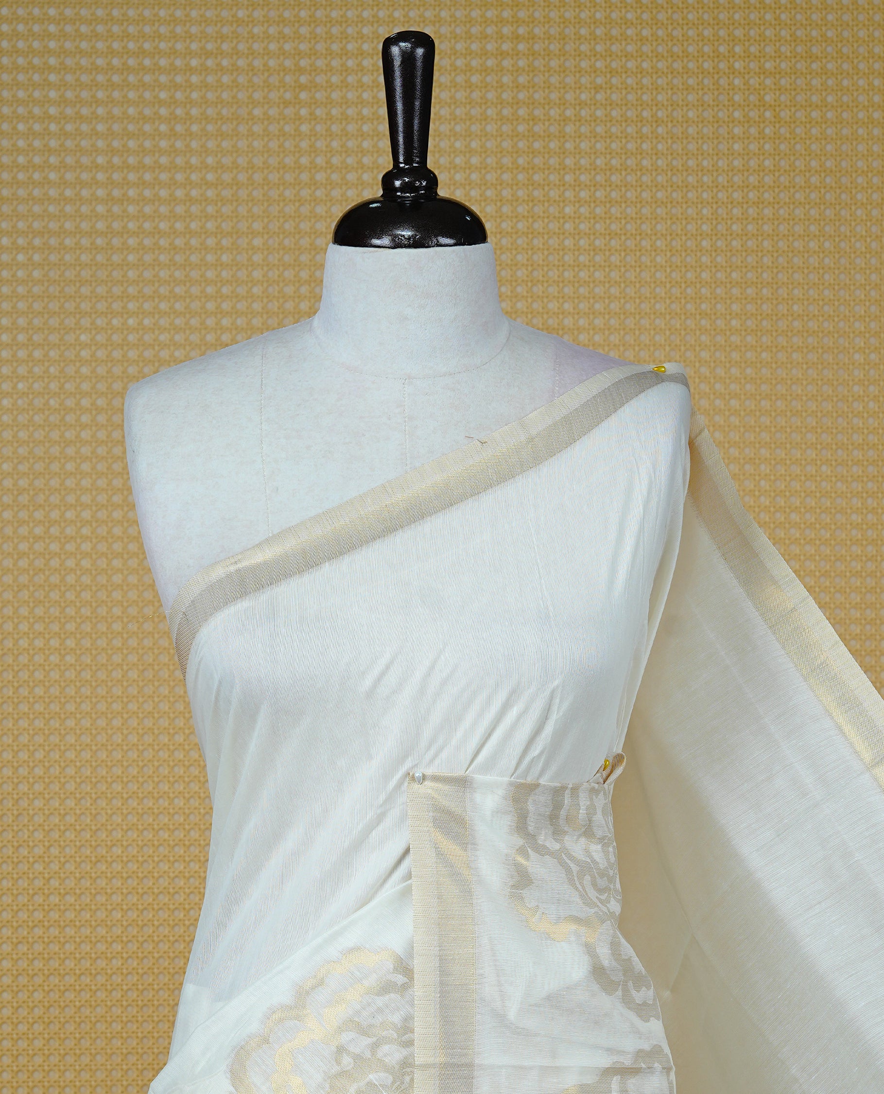 Cream Colour Organza Kerala Saree Featuring A Plain Body, Enriched By A Light Gold Zari Rose Patterned Border, Paired With A Matching Blouse Piece.