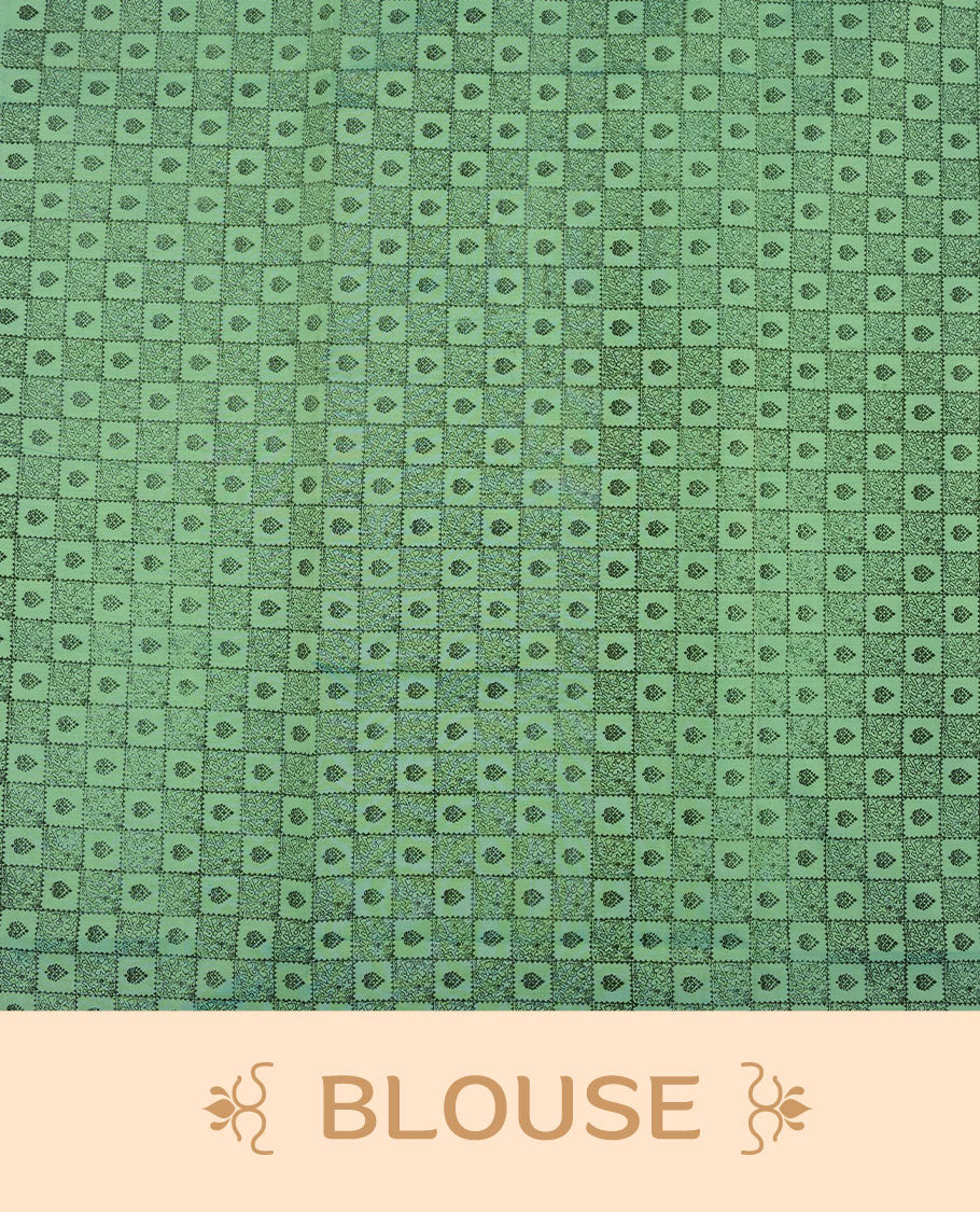 Pastel Green colour poly cotton saree with black vertical dotted line pattern on the body, paired with a matching pallu featuring black zigzag geometric border, and a coordinated all‑over black stylised fleur‑de‑lis printed blouse piece.