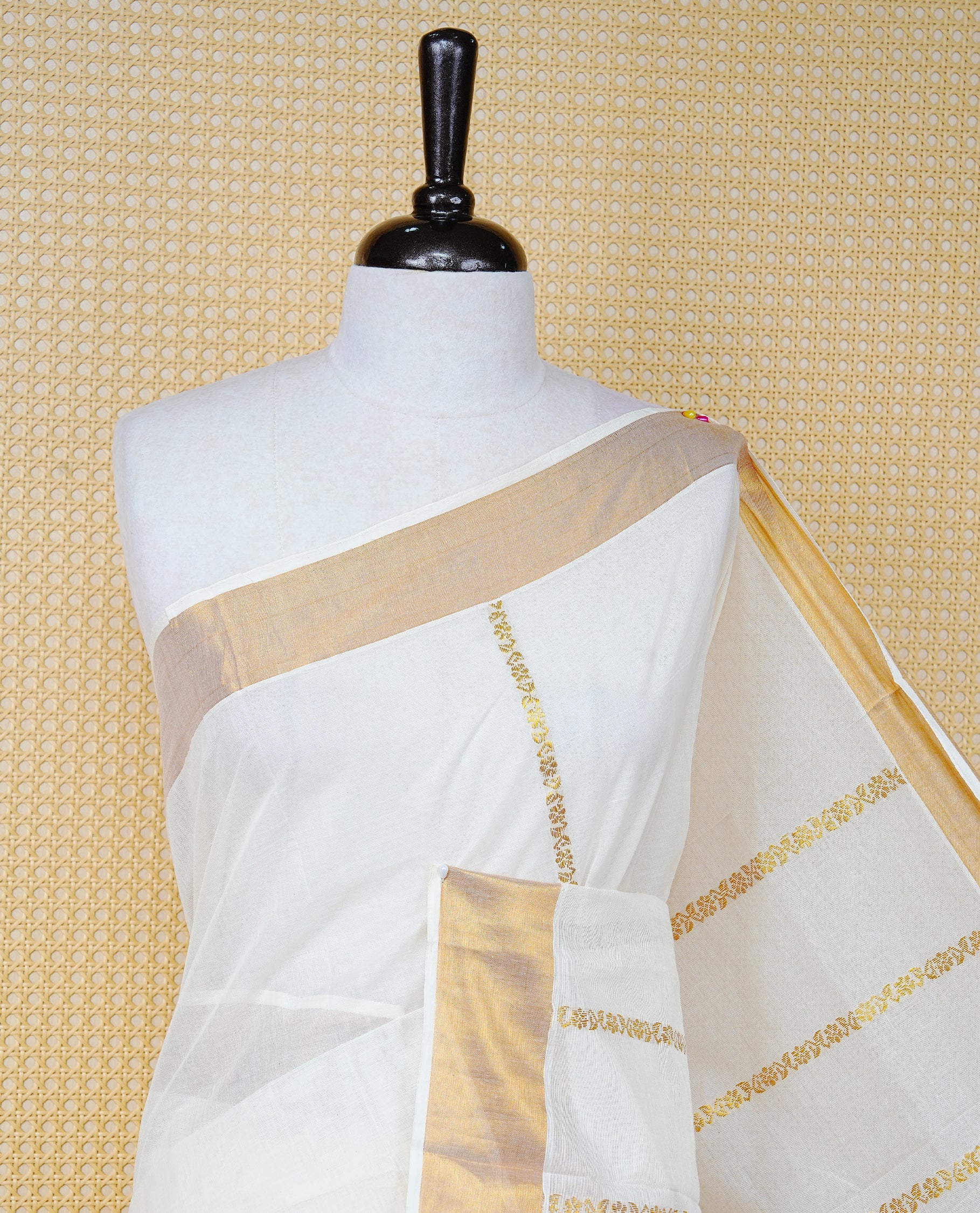 Cream Colour Cotton Kerala Saree Featuring an Elegant Plain Body, a Classy Gold Zari Border, and a Traditional Gold Zari Pallu with Blue Accents, Paired with a Matching Blouse Piece.