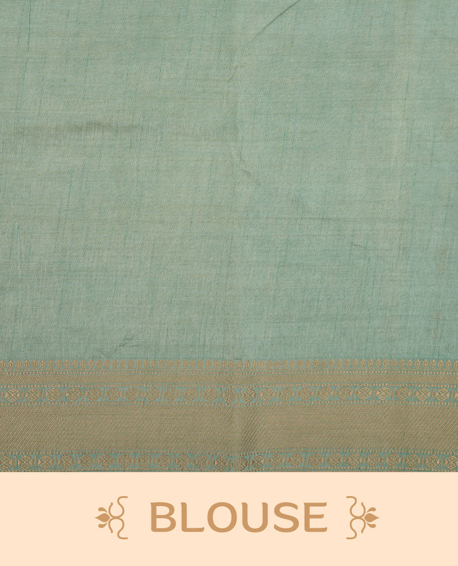 White gold colour semi tussar saree featuring Gold zari buttas body, contrast Ice blue colour gold zari border and comes with matching blouse piece.