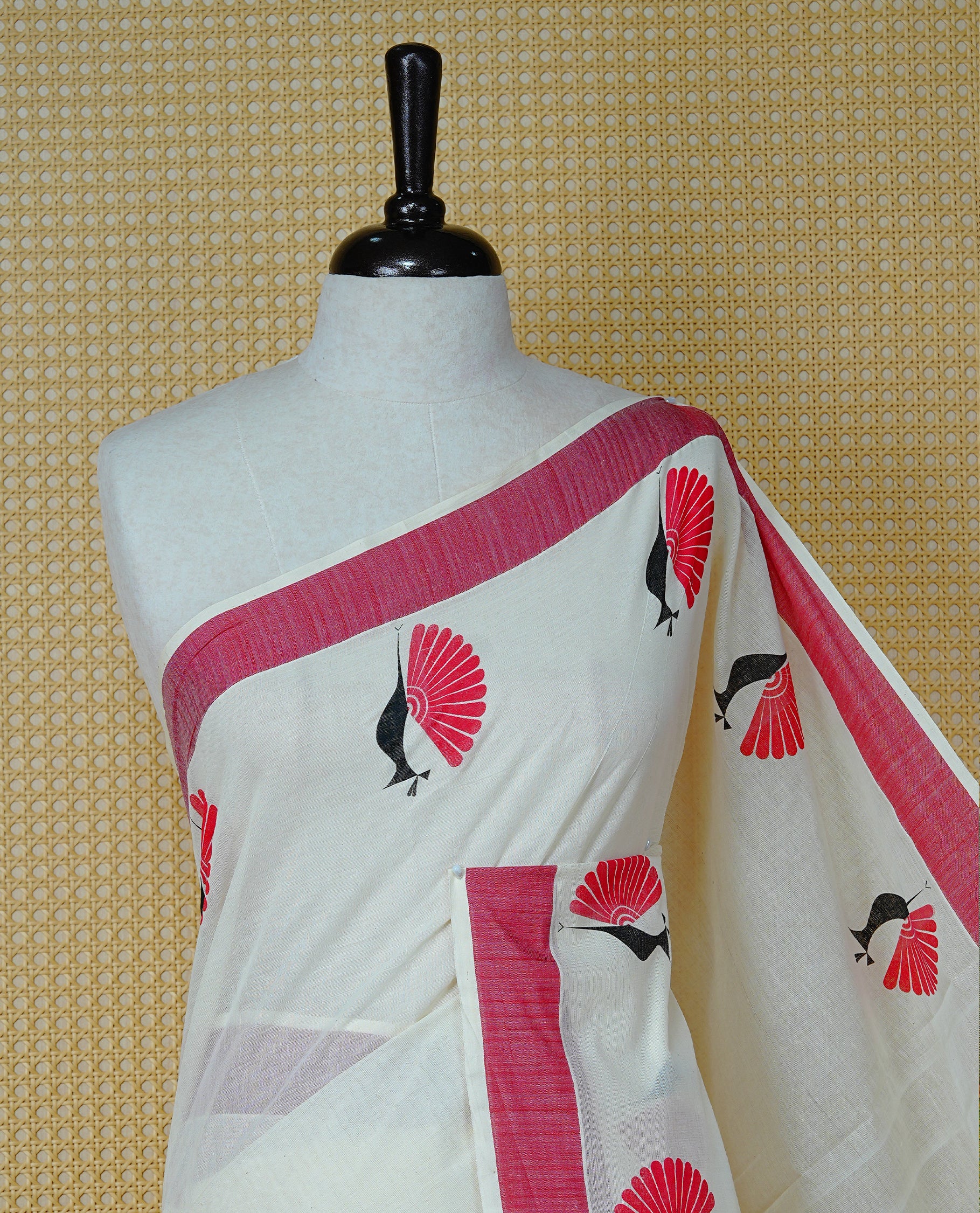 Cream colour Cotton Kerala saree Featuring Classy Plain body for Effortless Elegance, enhancing Red with Peacock Printed border, paired with matching blouse piece.
