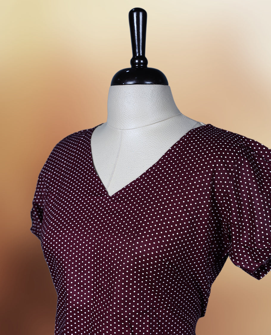 Brown colour nightwear with tiny off white colour polka dots, V neckline, and flutter sleeves & The flared hem with pleats adds a chic touch, Ideal for casual wear, office looks, or relaxed outings with a stylish twist.
