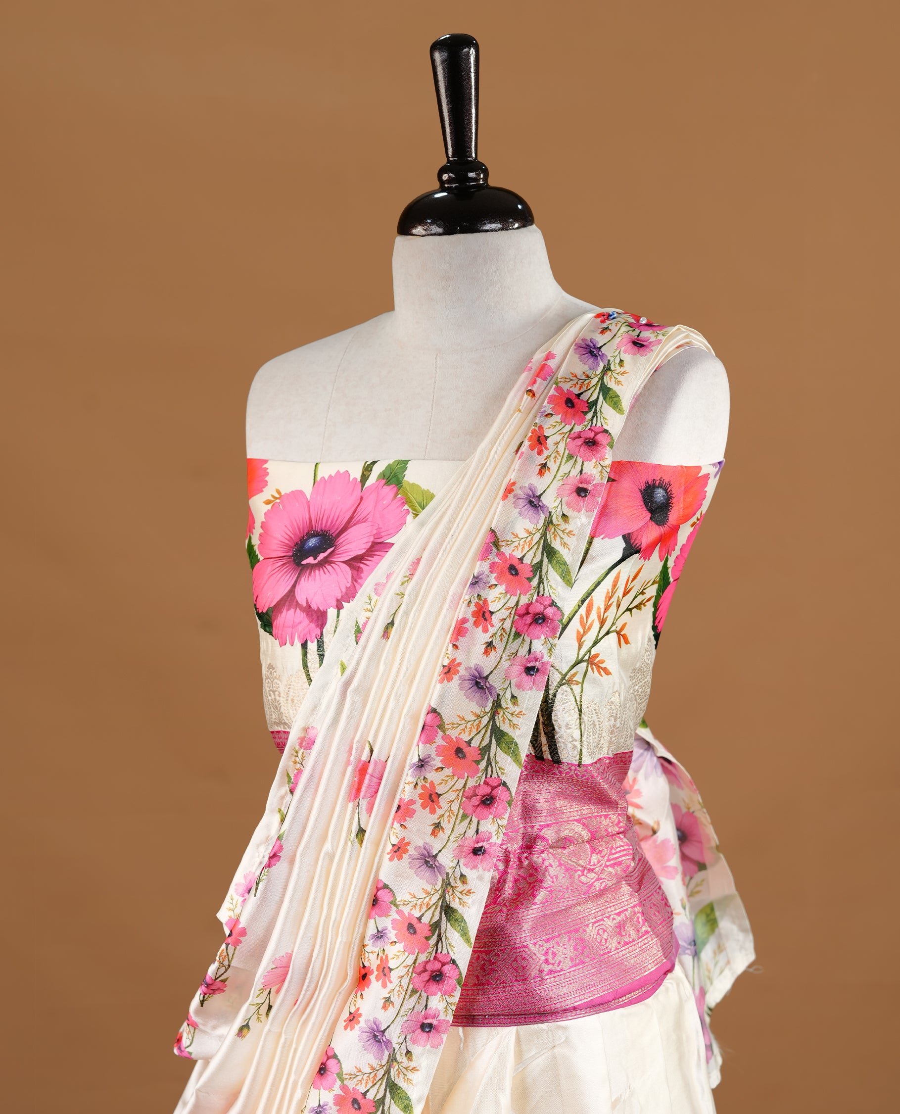 Off white colour semi stitched half saree featuring elegant Magenta colour floral prints, paired with a contrast Magenta with traditonal zari border and matching printed dupatta ,paired with matching blouse piece.