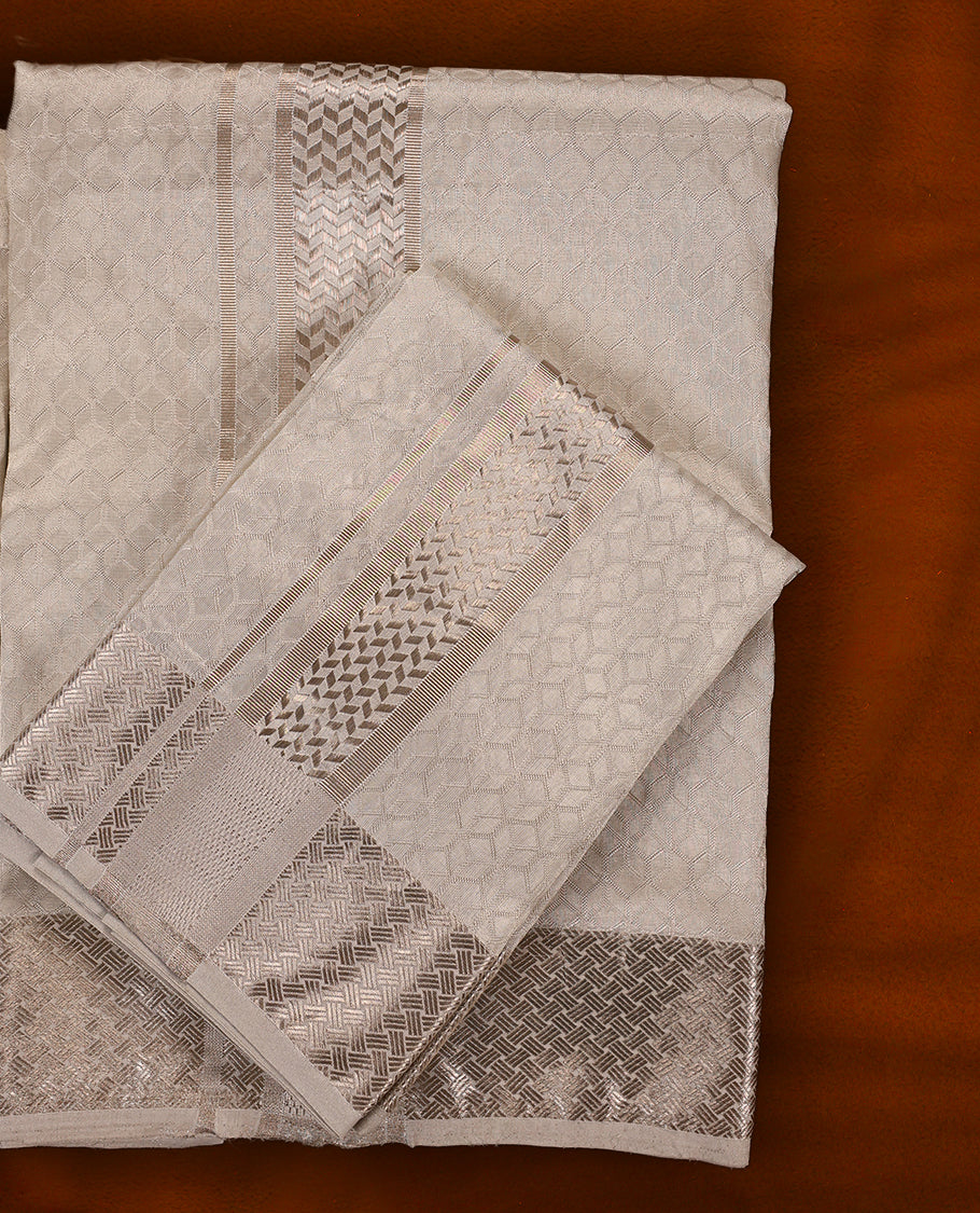 White silver colour MINISTER WHITE jacquard shirt with an all over textured weave, paired with a matching silver zari bordered dhoti featuring intricate geometric patterns, perfect for a refined traditional look.