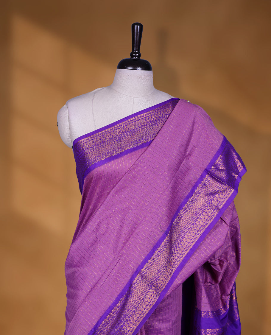 Lavender colour kalyani cotton saree featuring Antique zari check pattern on body, contrast Indigo colour border with antique zari pattern, paired with matching blouse piece.