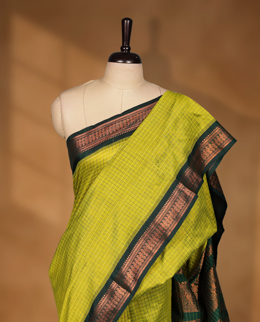Lemon colour kalyani cotton saree featuring Antique zari check pattern on body, contrast Green colour border with antique zari pattern, paired with matching blouse piece.