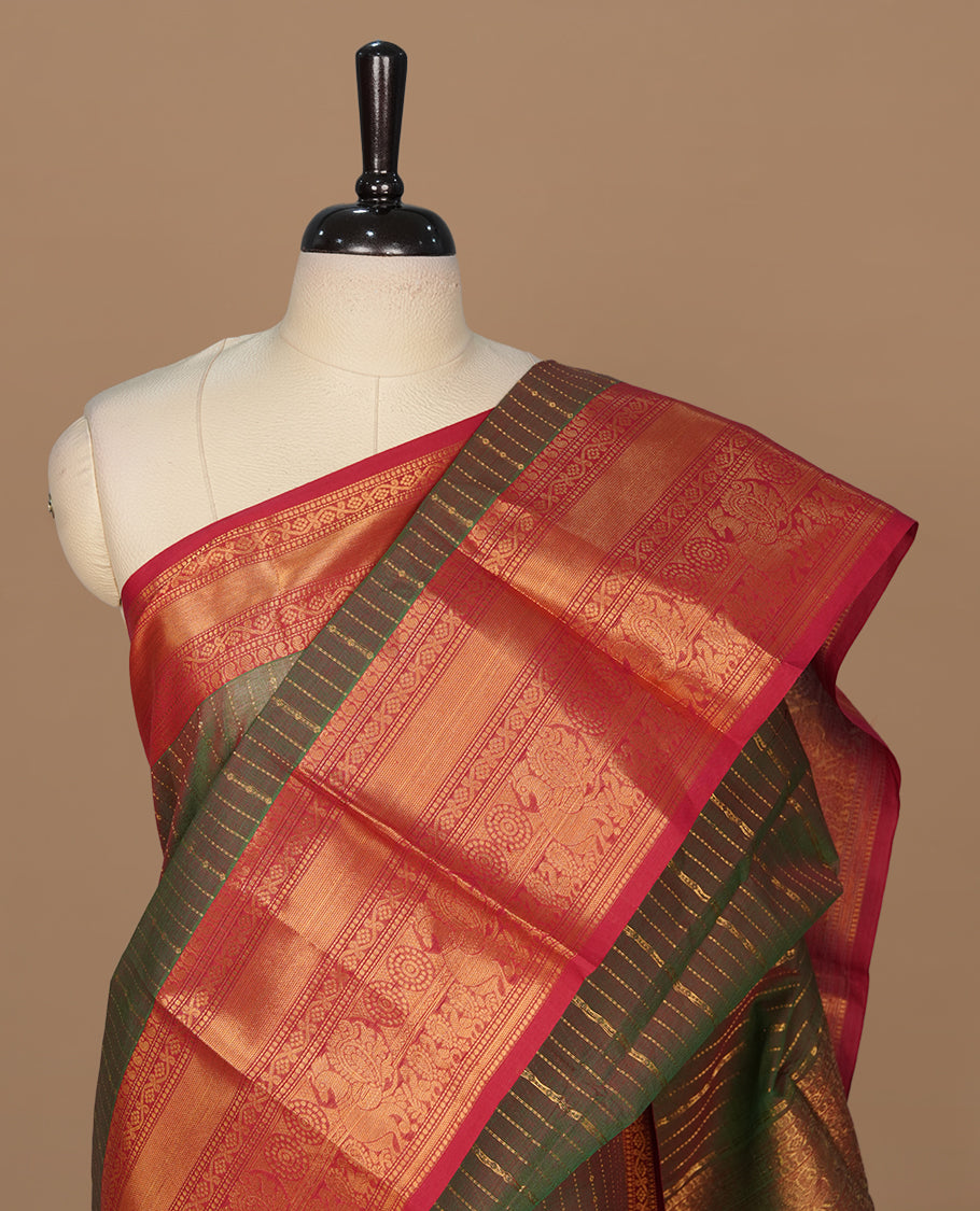 Green & red double shade colour chettinad saree featuring gold zari stripes on body, complemented by contrast Red colour with traditional border, paired with matching blouse piece.
