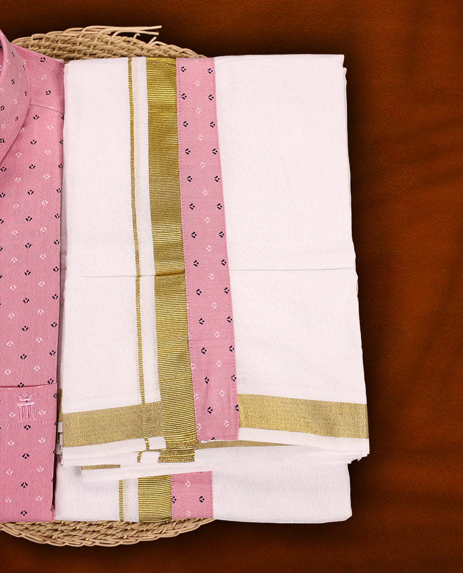 Pink colour MCR full sleeve shirt with delicate printed motifs, paired with a classic white dhoti featuring an elegant golden zari kara and a matching pink printed border.