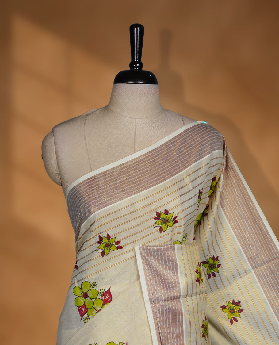 Light gold colour Tissue Kerala saree featuring a Plain body, an intricately woven gold and brown traditional border with floral and stripes on pallu, print paired with a matching blouse.