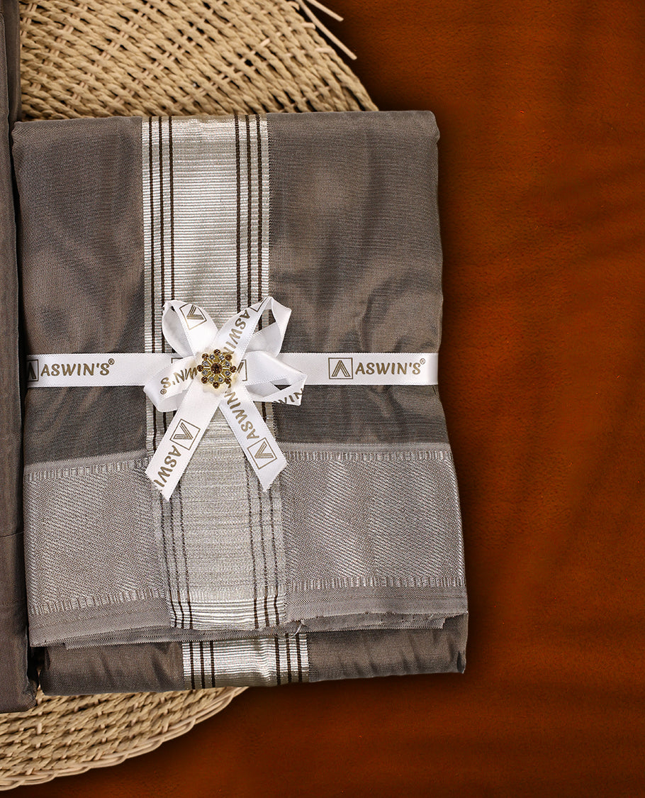 Copper colour Aswin’s wedding set featuring a premium silk finish full sleeve shirt, paired with a matching dhoti and angavastram accented with elegant silver zari work, ideal for festive and wedding occasions