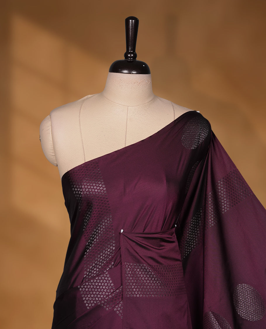 Deep plum colour soft silk saree featuring Antique zari motifs on body with Highlighting contrast Mustard colour pallu and paired with matching blouse piece.
